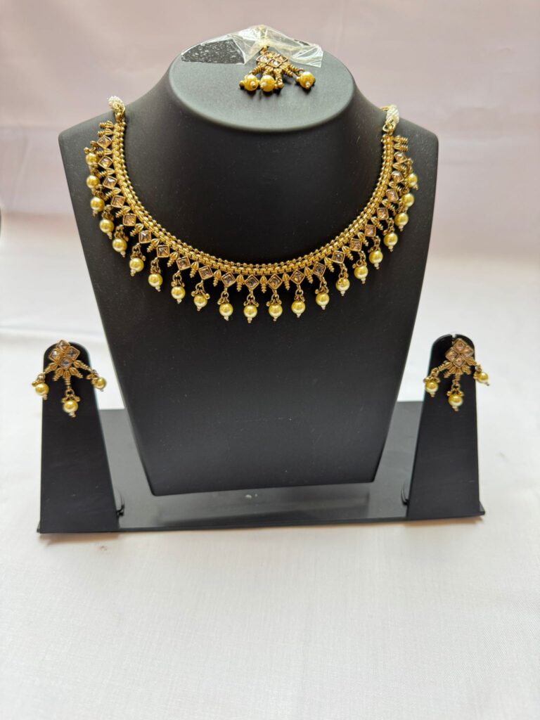 Bridal Accessories in Surrey,"Punjabi bridal chura in red and ivory", "Matching bangles set for suits","Imitation gold bridal necklace"